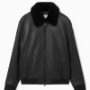 COS SHEARLING-TRIMMED LEATHER BOMBER JACKET- Coats & Jackets